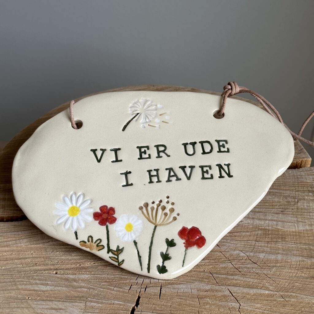 Vi er ude i haven skilt