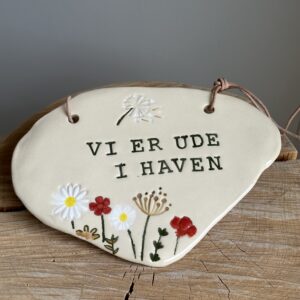 Vi er ude i haven skilt